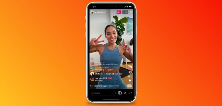woman showing peace signs on iphone showing Instagram Live.